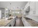 Bright kitchen boasts granite countertops, stainless steel appliances, and an adjacent dining area, ideal for Gathering meals at 2514 E Pleasant Ln, Phoenix, AZ 85042