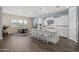 Bright open-concept kitchen with a large center island, ample seating, and modern appliances at 2514 E Pleasant Ln, Phoenix, AZ 85042