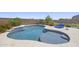 Sparkling pool with baja step, desert landscaping, and lounge area at 2514 E Pleasant Ln, Phoenix, AZ 85042