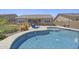 Sparkling pool featuring baja step, desert landscaping, and lounge area at 2514 E Pleasant Ln, Phoenix, AZ 85042