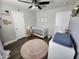 Cozy Bedroom with a crib, changing table, and charming decor to create a peaceful and nurturing environment at 2518 E Flower E St, Phoenix, AZ 85016