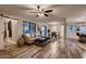 Open concept living room with wood-look flooring, neutral walls, and comfortable seating area at 2518 E Flower E St, Phoenix, AZ 85016