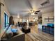 Open concept living space with tile flooring and a seamless flow into the dining and kitchen areas at 2518 E Flower E St, Phoenix, AZ 85016