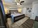 Comfortable main bedroom with a ceiling fan, plush bedding, and stylish decorative accents at 2518 E Flower E St, Phoenix, AZ 85016