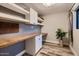 Bright home office area featuring custom desk, shelving and stylish decor at 2518 E Flower E St, Phoenix, AZ 85016