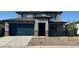 Charming two-story home with a two-car garage and well-maintained front yard with desert landscaping at 25360 W Bowker St, Buckeye, AZ 85326