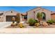 Charming home featuring desert landscaping with cacti and rock features at 26161 W Siesta Ln, Buckeye, AZ 85396