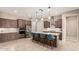 Modern kitchen with a large island, stainless steel appliances, and pendant lighting at 26161 W Siesta Ln, Buckeye, AZ 85396