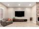 Inviting living room featuring a media center and natural light at 26161 W Siesta Ln, Buckeye, AZ 85396