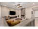 Comfortable living room with leather seating, fireplace feature, and neutral color palette at 26161 W Siesta Ln, Buckeye, AZ 85396