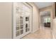 A bright hall area showing French doors into a living room, with tile floor at 26161 W Siesta Ln, Buckeye, AZ 85396