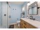 Modern bathroom with glass shower, stylish vanity and patterned tile accents at 2727 W Ocaso Cir, Mesa, AZ 85202