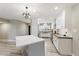 Bright kitchen with modern white cabinets, stainless steel appliances, and a central island at 2727 W Ocaso Cir, Mesa, AZ 85202