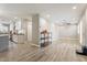 Bright and airy open-concept space with wood-look floors and seamless flow between rooms at 2727 W Ocaso Cir, Mesa, AZ 85202