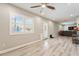 Open living area with hardwood floors, lots of light, and easy access to the backyard at 2727 W Ocaso Cir, Mesa, AZ 85202