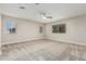 Spacious bedroom with neutral paint, carpeted floor and bright windows at 28263 N Welton Pl, San Tan Valley, AZ 85143
