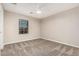 Bedroom with neutral walls, ceiling fan, carpet, and a window that allows natural light at 28263 N Welton Pl, San Tan Valley, AZ 85143
