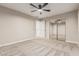 Bedroom features a mirrored sliding door closet, neutral walls, and carpet flooring at 28263 N Welton Pl, San Tan Valley, AZ 85143