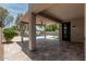 Relaxing covered patio overlooking pool and landscaped backyard at 28263 N Welton Pl, San Tan Valley, AZ 85143