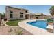 Stunning pool and backyard area with pavers, artificial turf, and lush landscaping at 28263 N Welton Pl, San Tan Valley, AZ 85143
