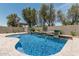 Inviting pool featuring a waterfall and spa, surrounded by desert landscaping and a pergola at 28263 N Welton Pl, San Tan Valley, AZ 85143