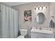 Charming bathroom with a whimsical leopard art and a shower with a curtain at 3007 N 84Th Pl, Scottsdale, AZ 85251
