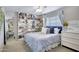 Inviting bedroom featuring built-in bookshelves and a comfortable bed at 3007 N 84Th Pl, Scottsdale, AZ 85251
