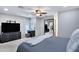 Spacious bedroom boasts a ceiling fan, a vanity, and a large mirror reflecting another room at 3007 N 84Th Pl, Scottsdale, AZ 85251