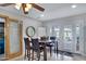 Cozy dining area with wood table, chairs, and natural light from the patio doors at 3007 N 84Th Pl, Scottsdale, AZ 85251