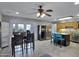 Open dining area featuring backyard access, a modern ceiling fan, and adjoins the kitchen at 3007 N 84Th Pl, Scottsdale, AZ 85251