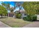 Well-maintained front yard with mature trees and a cozy single-story home at 3007 N 84Th Pl, Scottsdale, AZ 85251