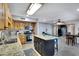Bright kitchen showcasing stainless appliances, a central island with seating, and natural light at 3007 N 84Th Pl, Scottsdale, AZ 85251