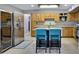 Modern kitchen boasts stainless steel appliances, custom cabinets, granite counters, and barstool seating at 3007 N 84Th Pl, Scottsdale, AZ 85251