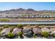 Stunning aerial view showcases the desert home in a scenic community near a canal and majestic mountains at 32096 N 132Nd Dr, Peoria, AZ 85383