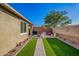 Well-maintained backyard with manicured lawn, fire pit, and shed, ideal for outdoor enjoyment and storage at 32096 N 132Nd Dr, Peoria, AZ 85383