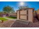 Backyard with a storage shed on a manicured lawn; great for outdoor storage and organization at 32096 N 132Nd Dr, Peoria, AZ 85383