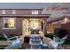 Lovely backyard with a covered patio, fire pit, and manicured lawn, perfect for enjoying outdoor living at 32096 N 132Nd Dr, Peoria, AZ 85383