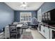 Comfortable room with built in desk and chair, with hanging chair and TV for relaxation at 32096 N 132Nd Dr, Peoria, AZ 85383