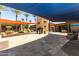 Serene courtyard with shade structures, desert landscaping, and decorative stone elements at 32096 N 132Nd Dr, Peoria, AZ 85383