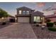 Charming two-story home boasts a well-manicured lawn and a spacious two car garage at 32096 N 132Nd Dr, Peoria, AZ 85383