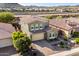 Charming two-story home showcasing a well-manicured front yard and a desert-style landscaped garden at 32096 N 132Nd Dr, Peoria, AZ 85383