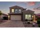 Attractive two-story home with an inviting paver driveway and manicured landscaping at 32096 N 132Nd Dr, Peoria, AZ 85383
