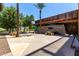 Community center exterior with picnic tables, desert landscaping, and unique stonework facade at 32096 N 132Nd Dr, Peoria, AZ 85383