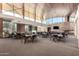 Spacious community center interior with large windows, wood ceilings, and ample seating for gatherings at 32096 N 132Nd Dr, Peoria, AZ 85383