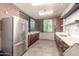 Well-equipped community kitchen with stainless steel appliances and ample counter space at 32096 N 132Nd Dr, Peoria, AZ 85383