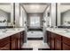 Luxurious bathroom showcasing a dual sink vanity, soaking tub, and elegant finishes at 32096 N 132Nd Dr, Peoria, AZ 85383