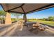 Outdoor picnic area featuring concrete tables with shaded structure provides residents a relaxing spot at 32096 N 132Nd Dr, Peoria, AZ 85383