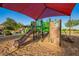 A shaded playground with slides and climbing structures offers fun for families at 32096 N 132Nd Dr, Peoria, AZ 85383