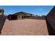 Large backyard featuring gravel surface, patio and block fence, great for outdoor activities at 3545 W Glass Ln, Phoenix, AZ 85041