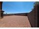 Spacious gravel backyard with block fencing for privacy and low maintenance at 3545 W Glass Ln, Phoenix, AZ 85041